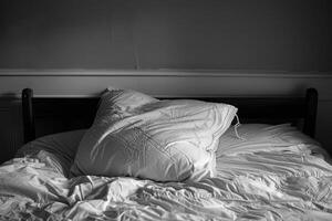Empty bed with a disheveled pillow, highlighting the restless tossing and turning of insomnia photo