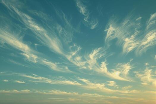 Wisps of cirrus clouds in a twilight sky photo