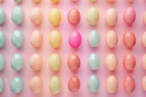 Colorful Easter eggs arranged in a pattern against a pastel backdrop photo