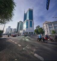Beautiful morning in district 1, view to Saigon Trade tower. Ho chi minh city is the one of the developed cities in Vietnam photo