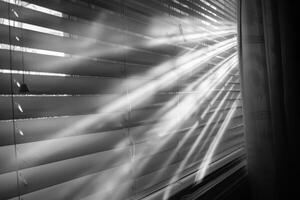 Heavenly light rays streaming through window blinds on a transparent white surface, adding a touch of coziness photo