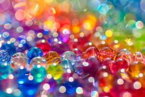 Rainbow-colored beads transparently scattered on a surface photo