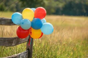 Colorful balloons tied to a wooden fence at a country fair, adding a festive touch photo