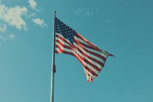 The American flag waving proudly in the wind photo