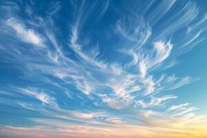 Wisps of cirrus clouds in a twilight sky photo