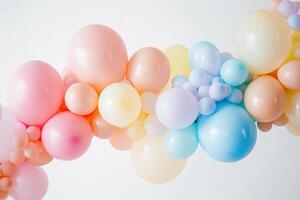 Cluster of pastel-colored balloons in various shapes and sizes, perfect for birthday parties photo