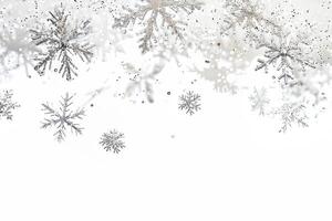 Glittering snowflake sparkles falling gently on a transparent white background, evoking images of winter wonderlands photo