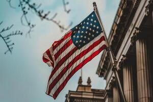 USA flag waving in front of a government building photo