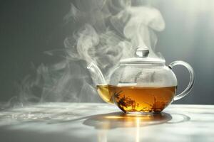A tea kettle is sitting on a table with steam coming out of it. The steam is rising and creating a hazy atmosphere photo