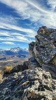 Rocky outcrops offering breathtaking views of distant peaks photo