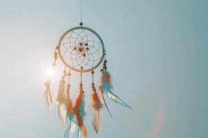 Bohemian dreamcatcher decoration against a soft transparent white surface, adding a touch of mystique photo