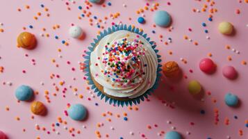 Levitating cupcake with sprinkles captured from above photo