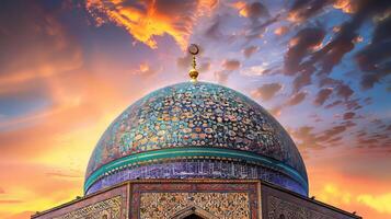 A blue dome with gold trim sits atop a building. The sky is filled with clouds and the sun is setting photo