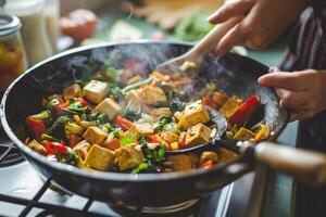 Woman cooking a vegetable stir-fry with tofu and brown rice, a plant-based and nutritious meal photo