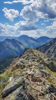 Rocky ridgelines offering panoramic views of distant peaks photo