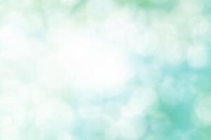 Blurred Spring Summer Nature Background with light Bokeh. Abstract blur blue and green soft pastel colors for backdrop. Defocused effect. Art clean blue cyan Illustration. Free Space for design photo