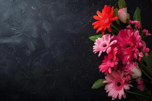 top view of composition of different bright flowers on black background. photo
