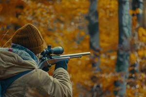 hunter with a gun in the forest, . photo