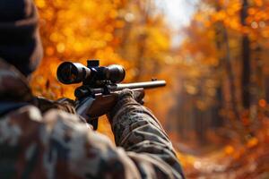 hunter with a gun in the forest, . photo