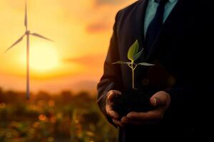 Business man using the tree plant to support environmental and sustainable development. ecological concept. photo
