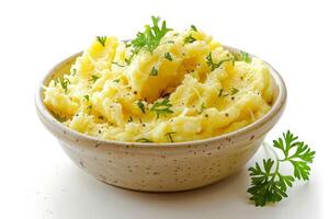 a dish of mashed potatoes with parsley in a bowl . photo