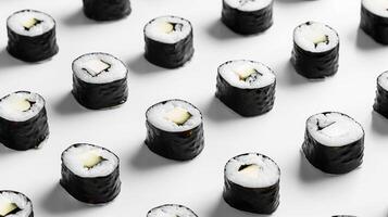 Minimalist arrangement of spinning sushi rolls in a minimalist pattern photo