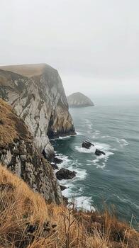 Rocky cliffs offering panoramic views of the ocean photo