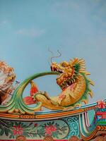 Dragon statue, dragon symbol, dragon Chinese, is a beautiful Thai and Chinese architecture of shrine, temple. A symbol of good luck and prosperity during the Chinese New Year celebrations. photo