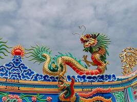Dragon statue, dragon symbol, dragon Chinese, is a beautiful Thai and Chinese architecture of shrine, temple. A symbol of good luck and prosperity during the Chinese New Year celebrations. photo