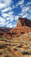 Majestic sandstone cliffs rising from desert plains photo