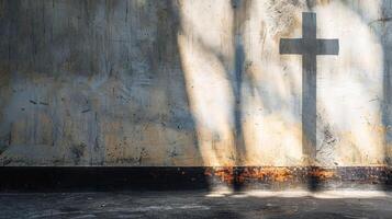 Large copy space adjacent to an image of a cross-shaped shadow on a wall photo