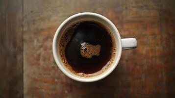 Overhead shot of a mug filled with hot coffee photo