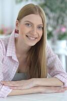 Portrait of young woman with deep blue eyes photo