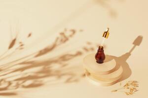 Cosmetic composition of Bottle with serum and pipette on a natural podium on a light background photo