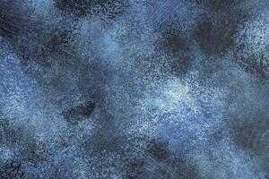 Blue abstract texture background of painted and scratched surface photo