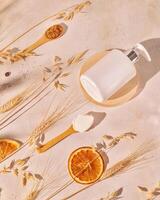 Spa composition with cosmetic bottle and wooden spoons with natural ingredients photo