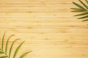 Light wooden background with green palm leaves photo