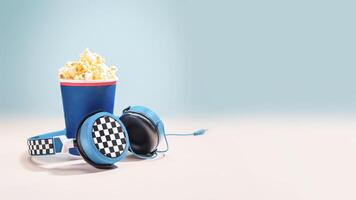 Disposable cup with popcorn and headphones on a light background photo