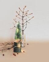 Decorative Christmas tree and crumbling old branches of the Christmas tree on a craft background photo
