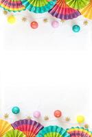 Colorful paper fans, lightening and stars on a white background with place for text photo