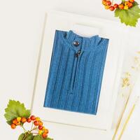 Knitted sweater made of expensive, natural fabric packed like a picture in a frame with a label for your brand photo