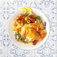 Homemade, grilled chicken with vegetables on a white plate photo