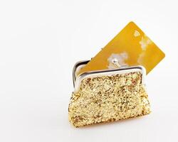 Gold wallet with gold credit card on white background photo