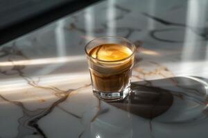 A cup of espresso on a marble countertop photo