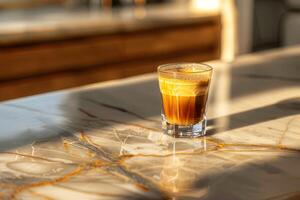 A cup of espresso on a marble countertop photo