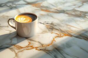 A cup of americano coffee on a marble countertop photo