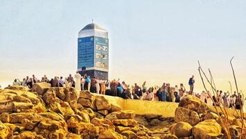 Mecca, Saudi Arabia on February 26, 2024. Jabal Rahmah in Arafah is the place where the Prophets Adam and Eve met after they were expelled from heaven. This is the place where they ask for forgivenes photo