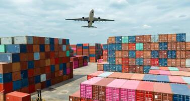 Airplane flying above container logistic. Container crisis. Freight transportation. Logistic industry. Container ship for export logistics. Container at the harbor for truck transport. Air transport. photo