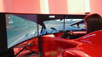 Ukraine. Kyiv MAY 10, 2023 A Child Drives A Sports Car Simulator Game. A large gaming club with simulators. video