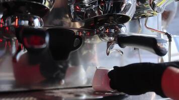 Preparation of double coffee in white cups close-up. Making espresso in a cafe video